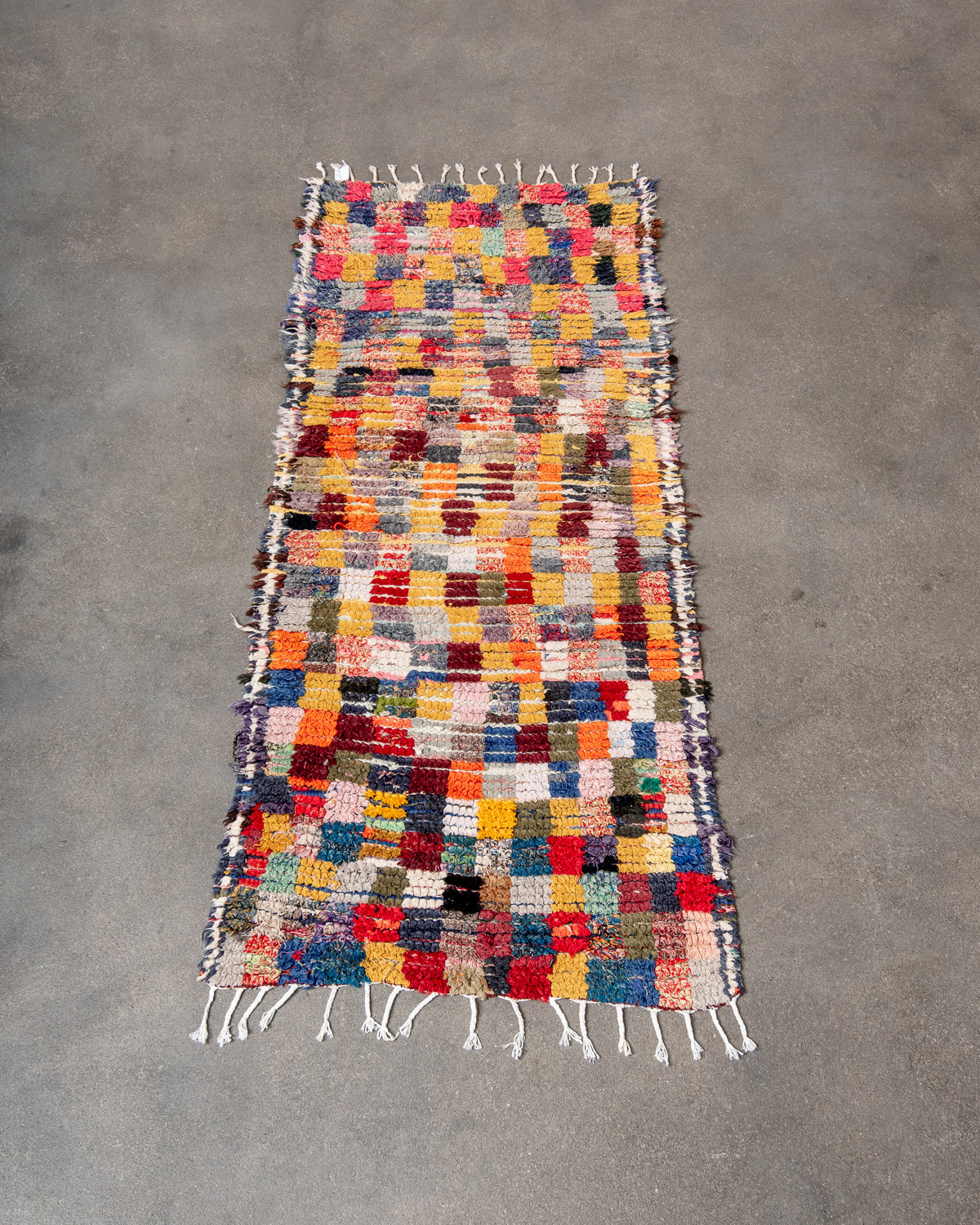 Modern designer vintage handcrafted Berber rug from Morocco. Boucherouite runner rug with beautiful colors and patterns.